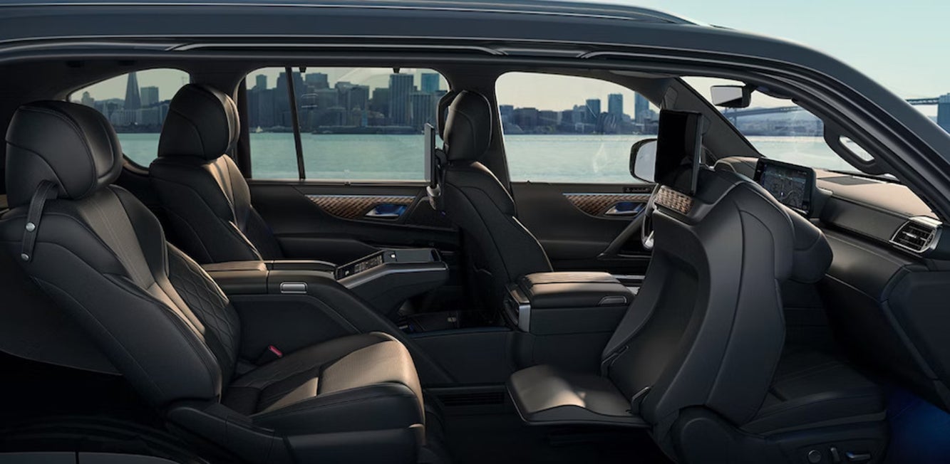 A side view into the interior of the 2025 Lexus LX Hybrid, with dark upholstery