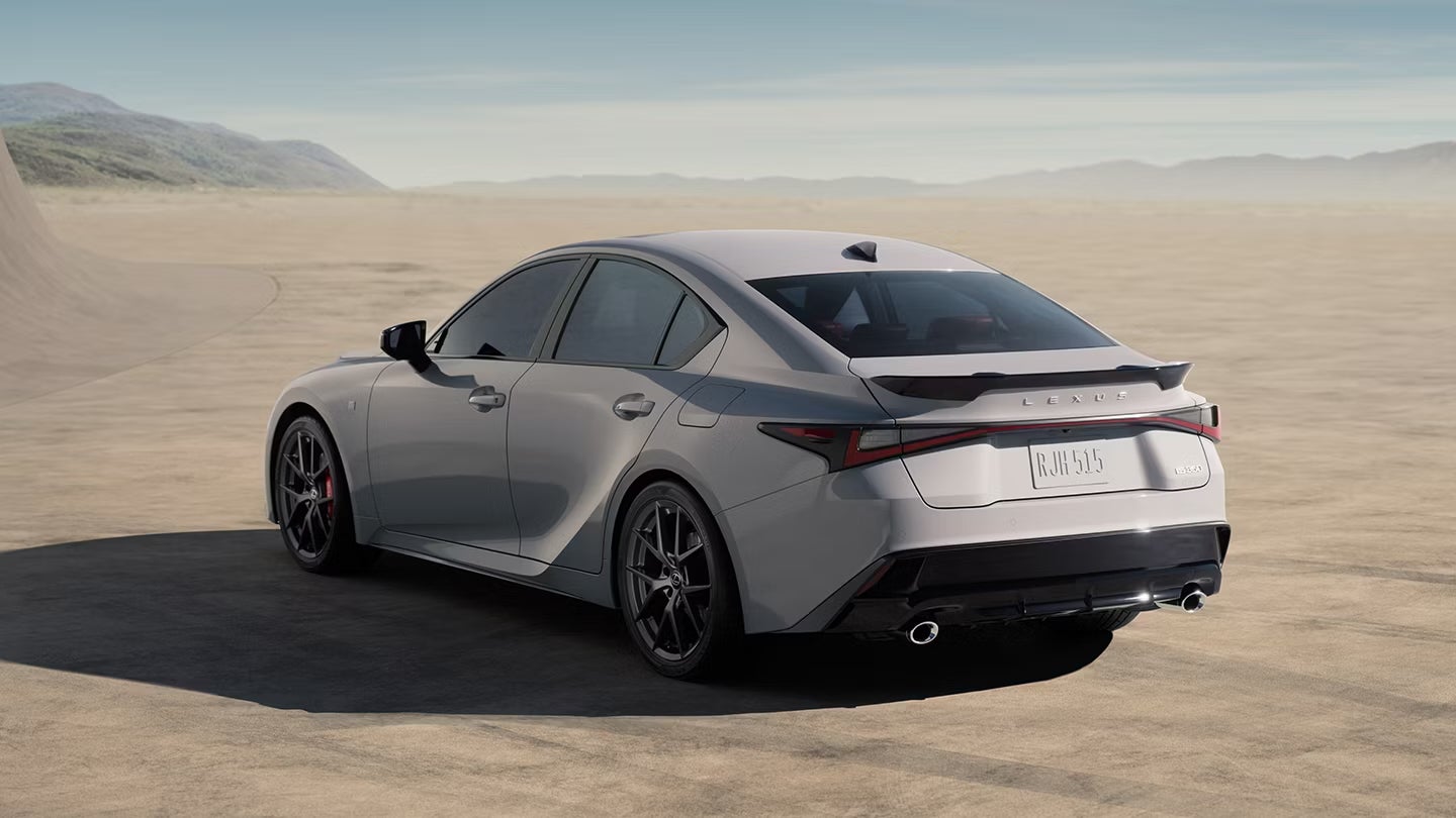 A gray Lexus IS sedan parked in the desert